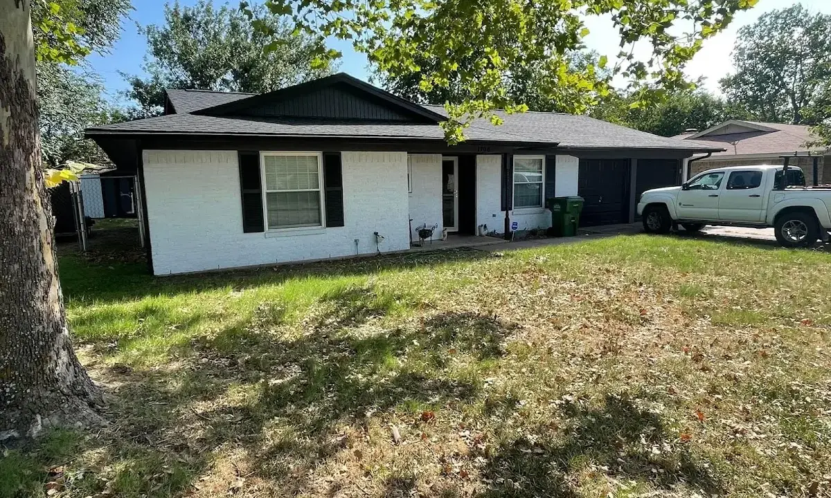 Professional roofing crew working on a residential roof in Lincoln